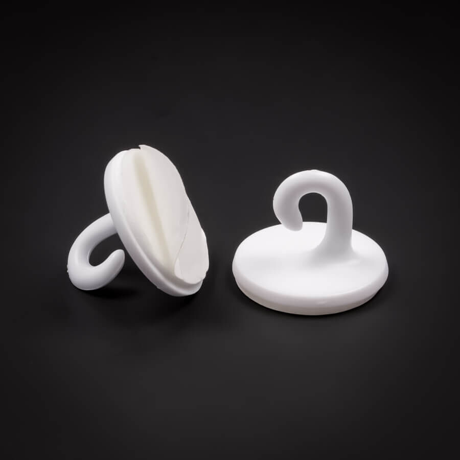 Haken selbstklebend 21 mm | Kunststoff | Haken | Dekohaken bis 200 g stehend und liegend auf dunklem Untergrund