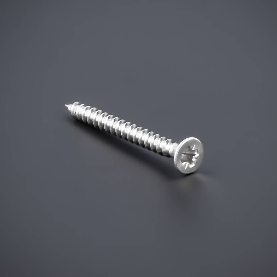 Schraube 3,5x40 mm Edelstahl V2A A2 Senkkopf Vollgewinde | Kreuz liegend auf dunklem Untergrund