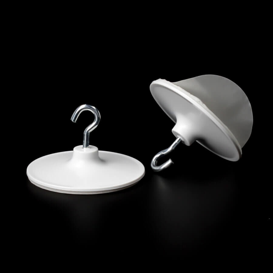 Selbstklebende Aufhänger mit Haken 39 mm | Kunststoff | bis 400 g stehend und liegend auf dunklem Untergrund