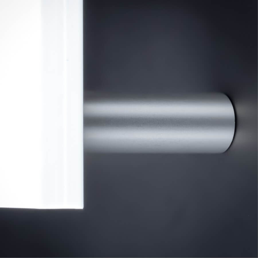 Abstandshalter verdeckte Montage Ø13x40mm weißes Acrylschild an dunkler Wand montiert