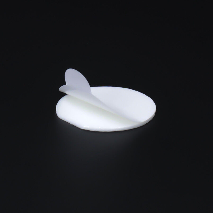 Rolle Klebepunkte Ø25x1mm beidseitig selbstklebend einzelner Klebepunkt auf dunklem Untergrund