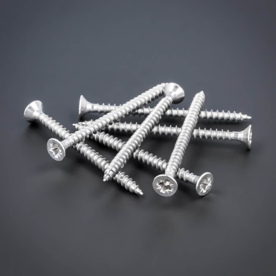 Schraube 3,5 x 50 mm, Edelstahl V2A - A2, Senkkopf - Kreuz Vollgewinde größere Stückzahl liegend auf dunklem Untergrund
