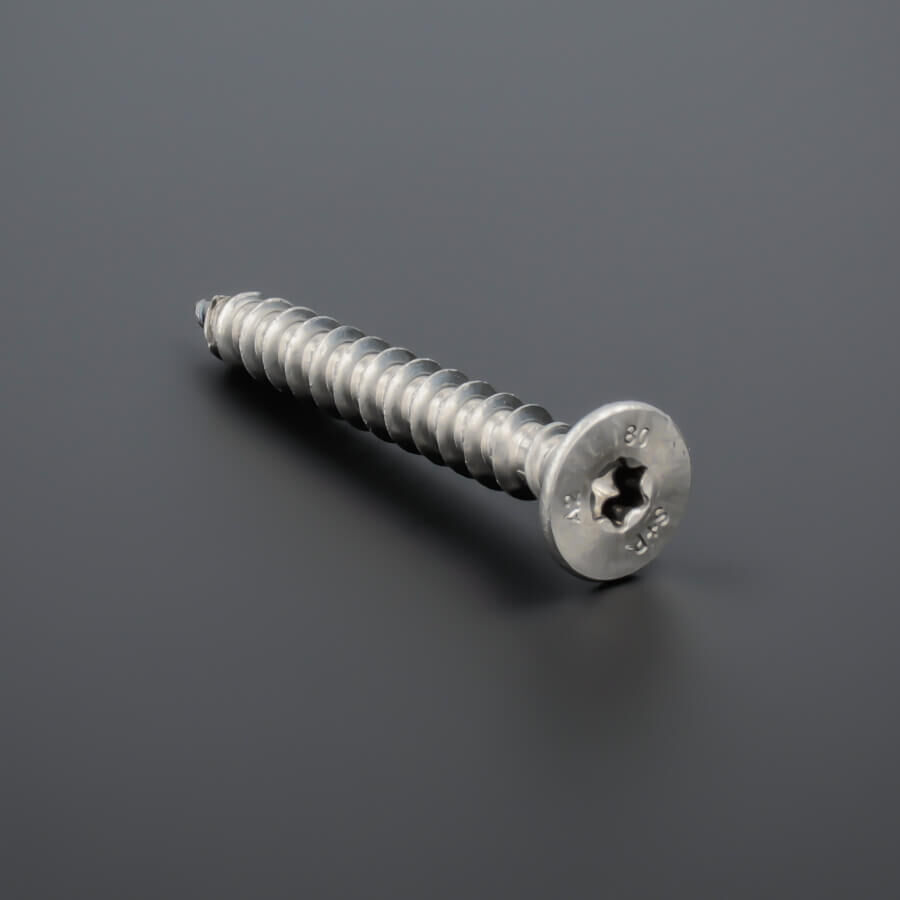 Schraube 10x80 mm Edelstahl V2A liegend von vorne auf dunklem Untergrund