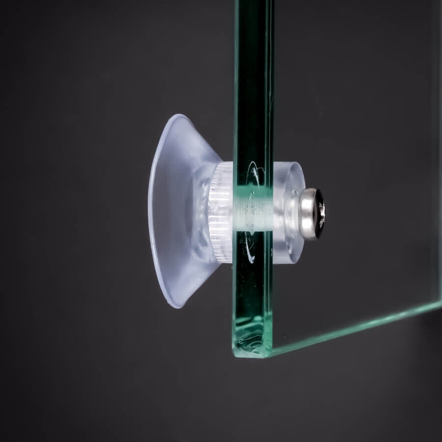 Saugnapf Ø30mm mit Innengewinde an Glasplatte montiert auf vor Hintergrund