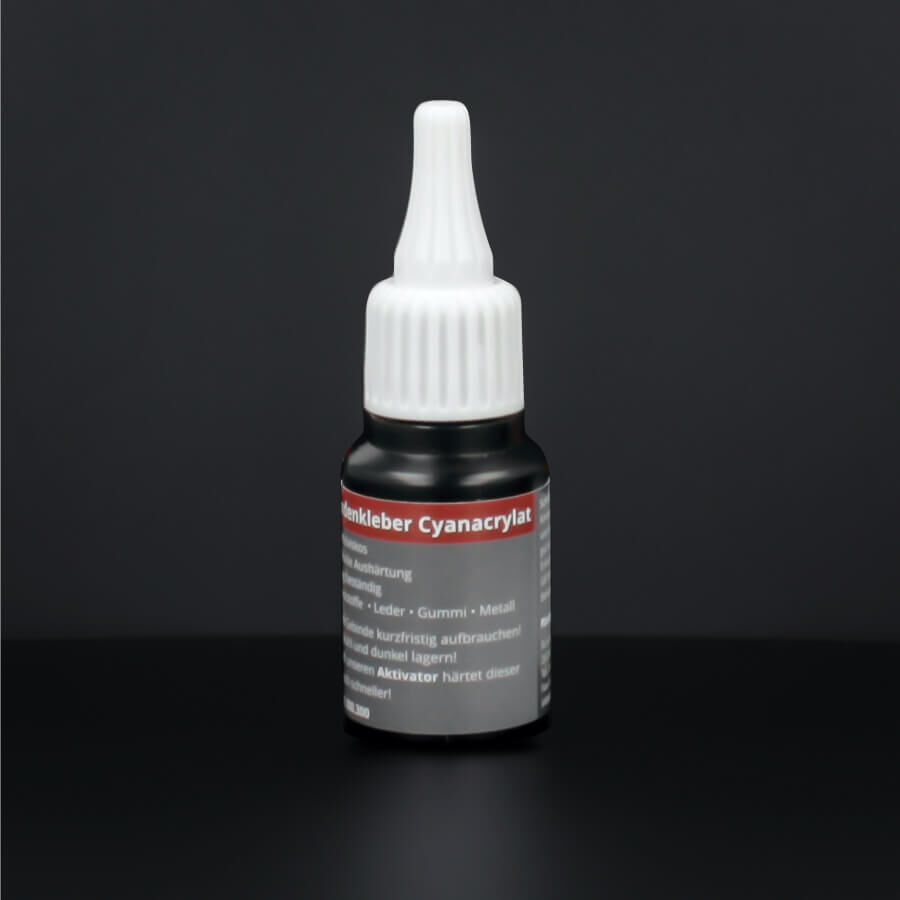 Sekundenkleber Spezialkleber 20ml Cyanacrylat stehend auf dunklem Untergrund
