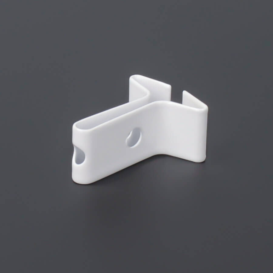 Deckenklemme Deckenclip gedreht liegen auf dunklem Untergrund